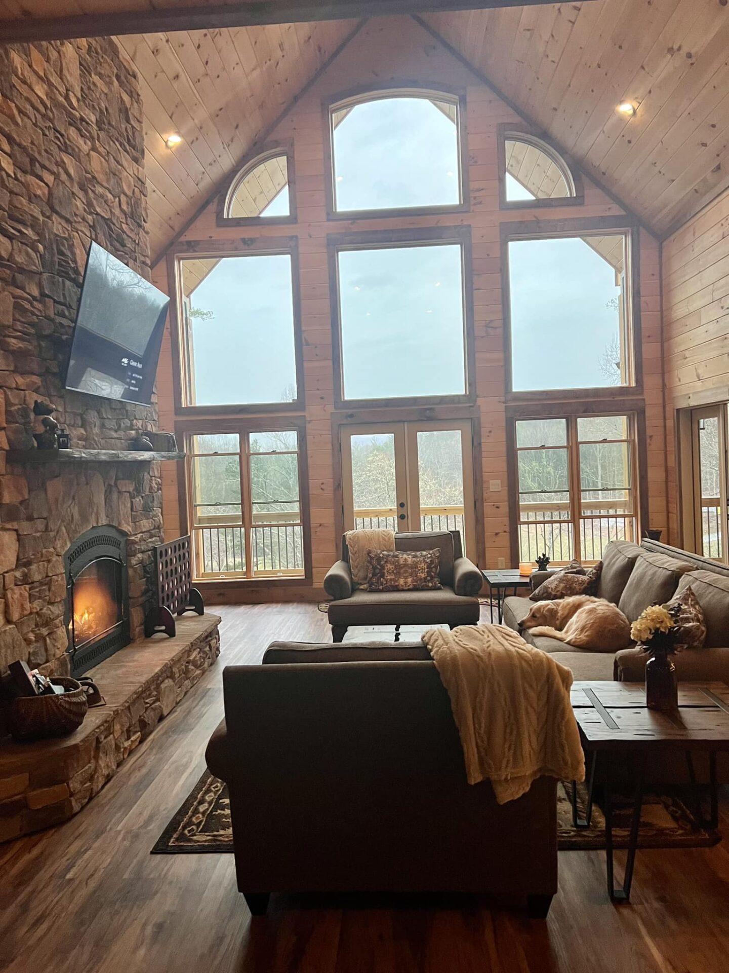 living area with a view Living Room with sofa set and TV